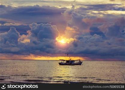 beautiful sunset over the old fishing boat