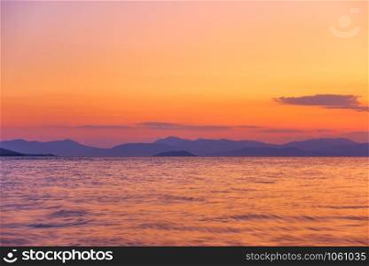 Beautiful sunset over the sea and islands - Landscape - seascape. May be used as background