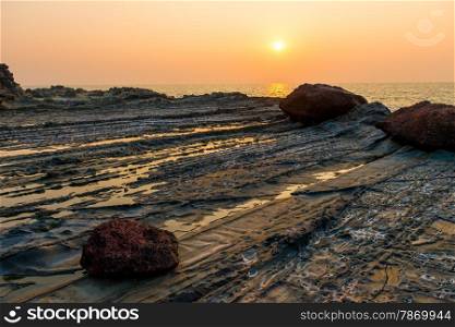 beautiful sunset over the sea and rocky