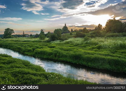 Beautiful sunset over the village of Mikhailovskoye, Ivanovo region, Russia.