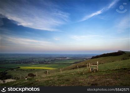 Beautiful sunset sky over countryside landscape in Summer