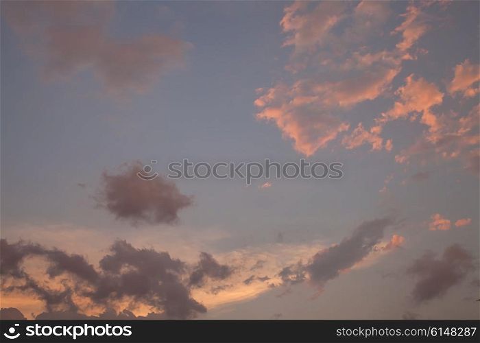 Beautiful sunset sky with yellow sunny clouds