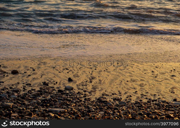 Beautiful sunset view of breaking waves at Petra tou Romiou beach, in Paphos, Cyprus. It is considered to be Aphrodite&rsquo;s birthplace in Greek mythology.