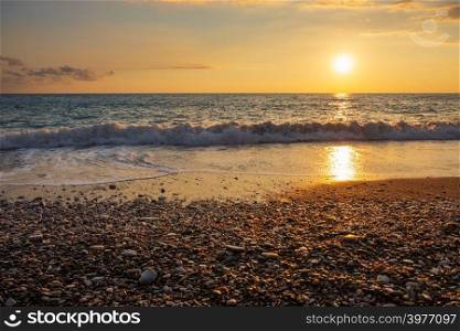 Beautiful sunset view of breaking waves at Petra tou Romiou beach, in Paphos, Cyprus. It is considered to be Aphrodite&rsquo;s birthplace in Greek mythology.
