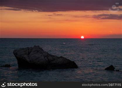 Beautiful sunset view of the beach around Petra tou Romiou, in Paphos, Cyprus. It is considered to be Aphrodite&rsquo;s birthplace in Greek mythology.
