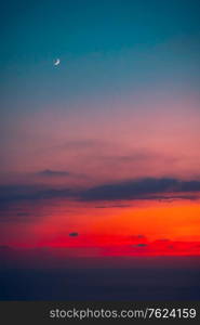 Beautiful sunset with a moon, new moon, beauty of a moon cycle, amazing night skyscape, autumn season nature