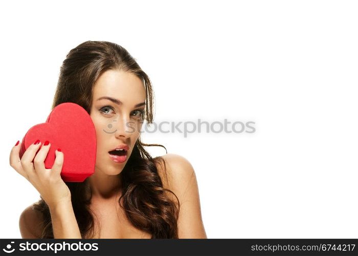 beautiful surprised woman with a red heart. beautiful surprised woman with a red heart on white background