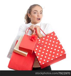 Beautiful Surprised Young Woman Holding Shopping Bags and Looking Away. Red and White Colors.