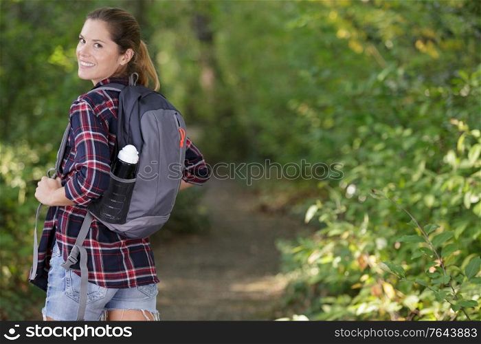 beautiful sweet woman hiker looking at camera