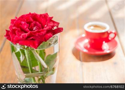 Beautiful table decorated with coffee and red rose, stock photo