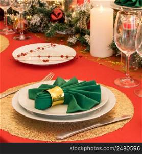 Beautiful table setting with Christmas decorations. Red colors. christmas table decoration