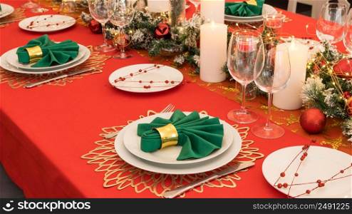Beautiful table setting with Christmas decorations. Red colors. christmas table decoration