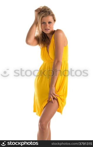 Beautiful tall blonde woman in a short yellow dress