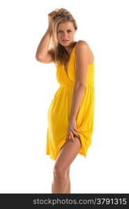 Beautiful tall blonde woman in a short yellow dress