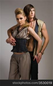 Beautiful tall couple in stylish vests and pants