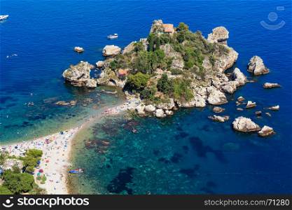 Beautiful Taormina Isola Bella beach and Isola Bella islet view from up, Sicily, Italy. Summer Sicilian landmark seascape with sea coast, beaches and island. Peoples unrecognizable.