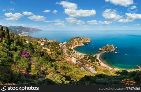 Beautiful Taormina panoramic view from up  Stairs to Taormina , Sicily, Italy. Sicilian seascape with coast, beaches and island Isola Bella. People unrecognizable.