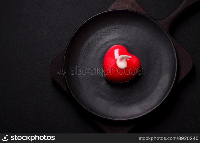 Beautiful tasty cake red color cheesecake in the shape of a heart. Sweets for Valentine&rsquo;s Day