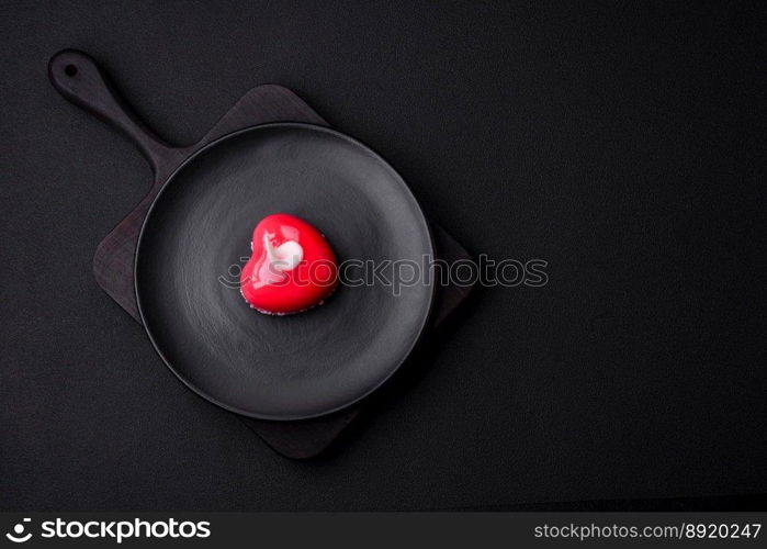 Beautiful tasty cake red color cheesecake in the shape of a heart. Sweets for Valentine’s Day