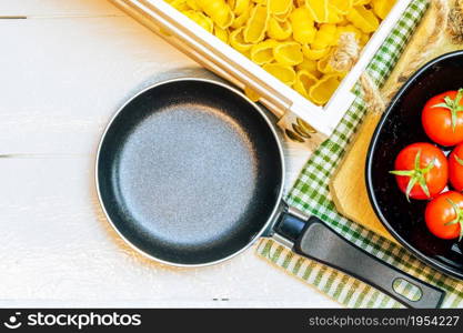 Beautiful tasty Italian pasta, tomatoes, onions and garlic for cooking pasta