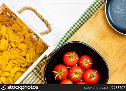 Beautiful tasty Italian pasta, tomatoes, onions and garlic for cooking pasta
