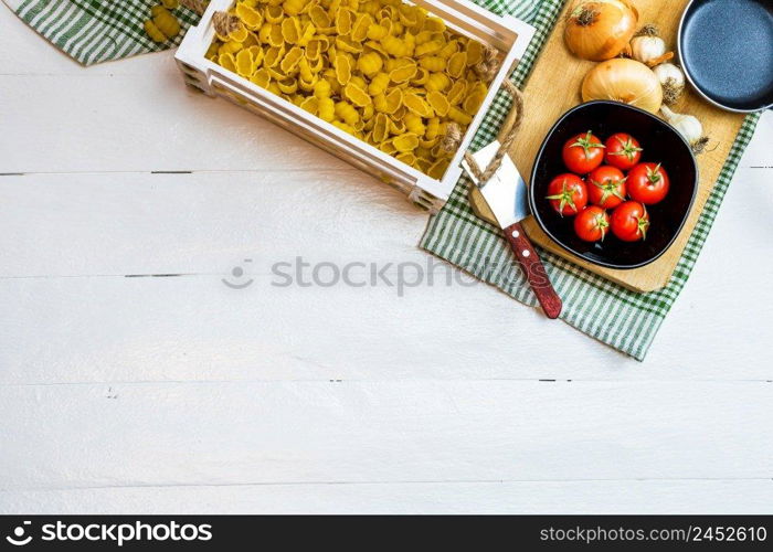 Beautiful tasty Italian pasta, tomatoes, onions and garlic for cooking pasta