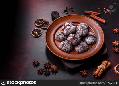 Beautiful tasty sweet cookie brownies on a brown plate on a dark concrete background. Beautiful tasty sweet cookie brownies on a brown plate