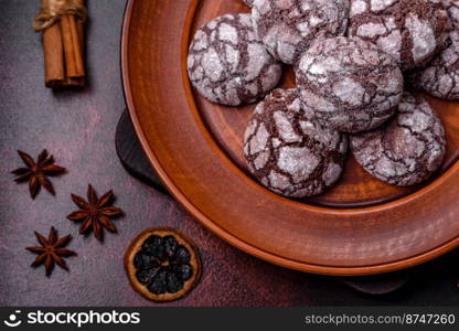 Beautiful tasty sweet cookie brownies on a brown plate on a dark concrete background. Beautiful tasty sweet cookie brownies on a brown plate