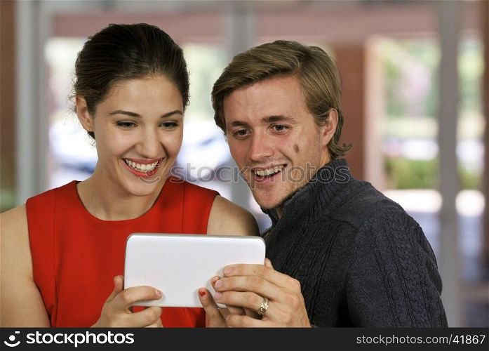 Beautiful technologically savvy woman using a tablet