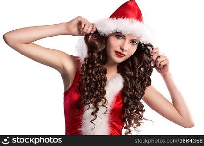 beautiful teen brunette with long curls wearing a red santa claus costume with white fur