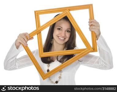 Beautiful teen girl holding frames up in front of face.