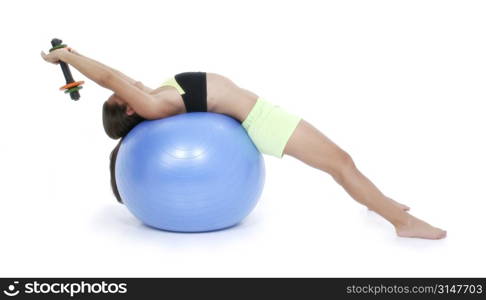 Beautiful Teen Girl In Workout Clothes On Exercise Ball with hand weights.