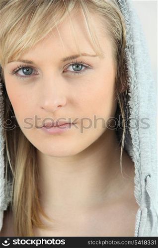 beautiful teenage blonde wearing hoodie