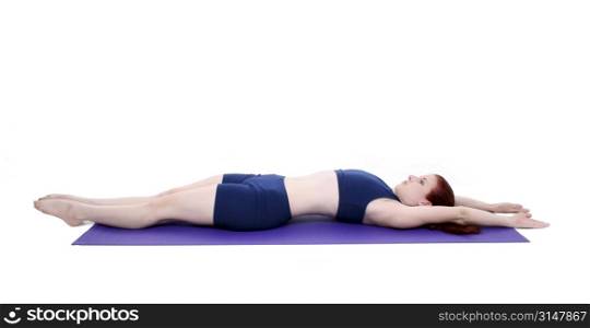 Beautiful Teenage Girl Demonstrating A Pilates Stretch Position over white.