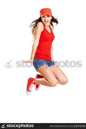 Beautiful teenage girl jumping of happiness isolated on white