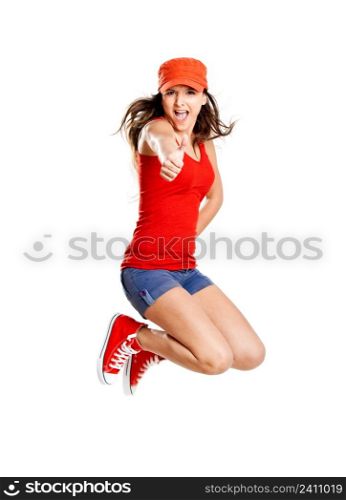 Beautiful teenage girl jumping of happiness isolated on white