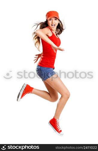 Beautiful teenage girl jumping of happiness isolated on white 