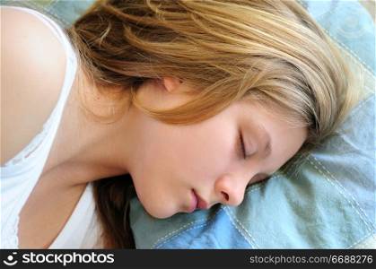Beautiful teenage girl sleeping in the morning
