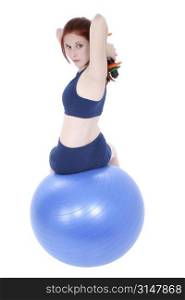 Beautiful Teenage Girl With Hand Weights And Exercise Ball. 17 year old girl with long red hair over white.