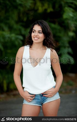 Beautiful teenager brunette girl with jeans shorts