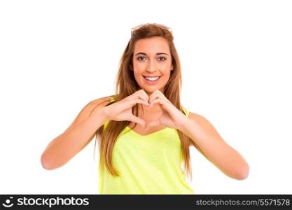 Beautiful teenager making a heart shape with her hands, isolated over white background