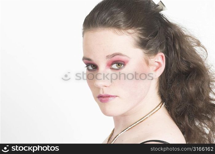 Beautiful teenager with pink make-up