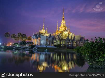 beautiful temple thailand dramatic colorful sky twilight sunset shadow on water reflection with light - Landmark Nakhon Ratchasima province temple at Wat None Kum in Thailand