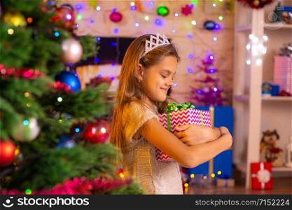 Beautiful ten-year-old girl received a gift from Santa Claus