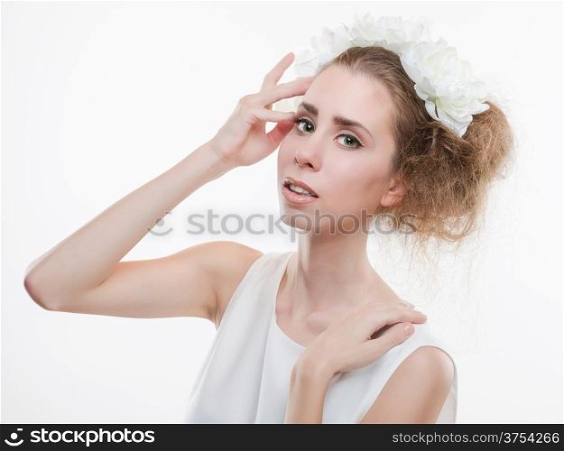 Beautiful tender woman wearing headpiece and white dress