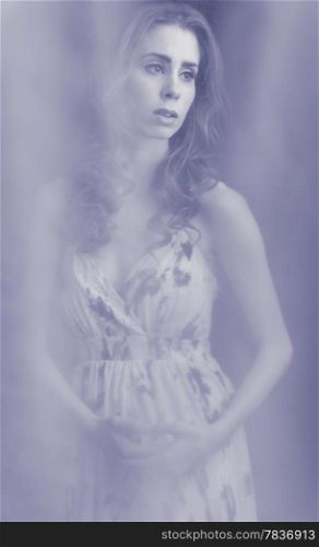 Beautiful tender young woman, tinted blue black and white image