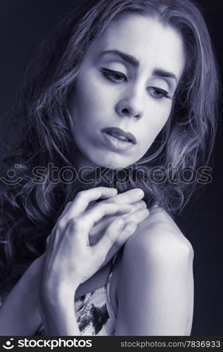 Beautiful tender young woman, tinted blue black and white image