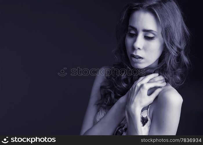 Beautiful tender young woman, tinted blue black and white image