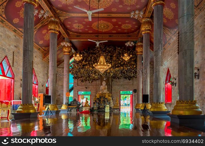 beautiful Thai temple inside with Buddha on the altar, no people