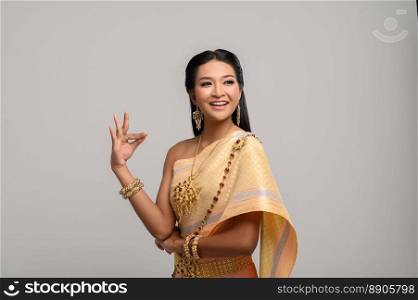 Beautiful Thai woman wearing Thai dress and Thai dance